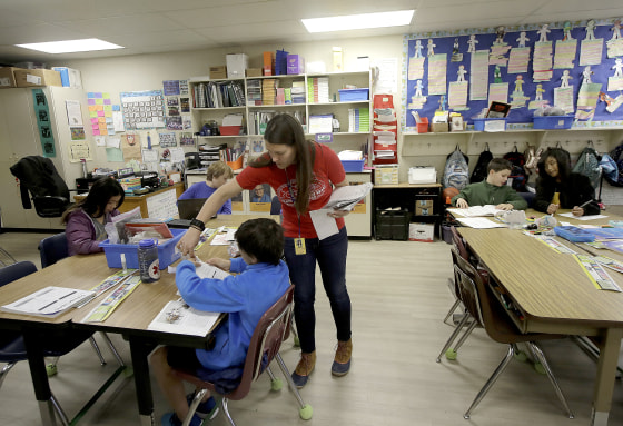Laura Shield, a fourth grade teacher at Chabot Elementary School in Oakland, California, with a student in March.