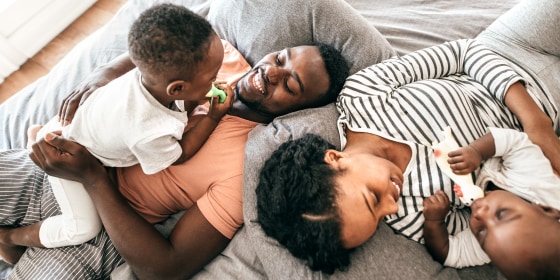 Family laying down and relaxing at home.
