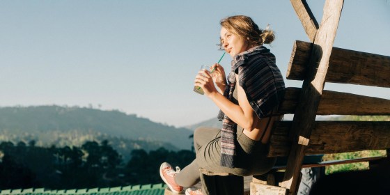 Woman drinking iced tea on the bench