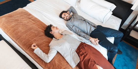 Honeymoon couple relaxing on the bed