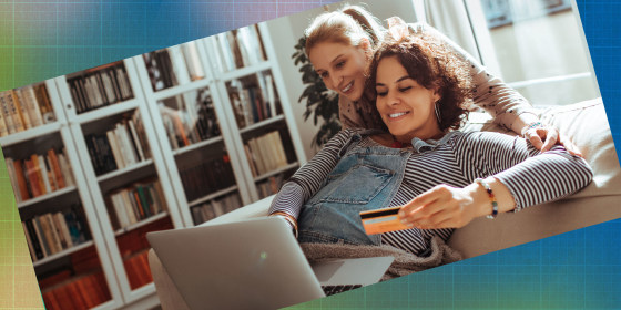 Close up of a female couple online shopping on their laptop