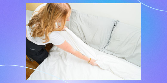 Overhead view of someone making a bed