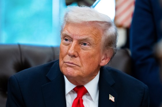 President Donald Trump sits in the Oval Office.