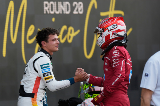 McLaren driver Lando Norris of Britain, left, the pole position winner, is congratulated by Ferrari driver Charles Leclerc of Monaco, who qualified second, during the qualifying session for Formula One Mexico Grand Prix auto race at the Hermanos Rodriguez race track in Mexico City, Saturday, Oct. 25, 2025.