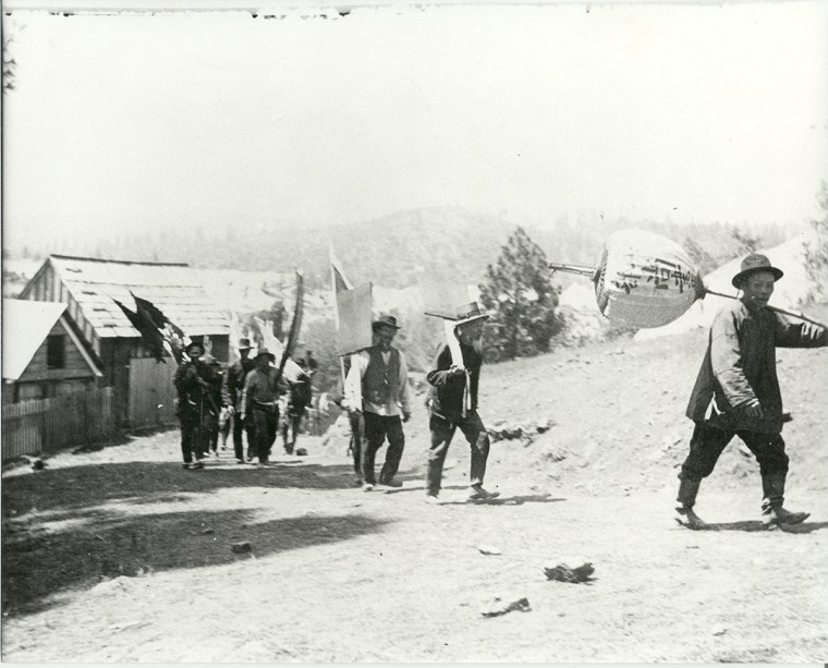 A funeral procession of Chinese railroad workers near Dutch Flat, California.