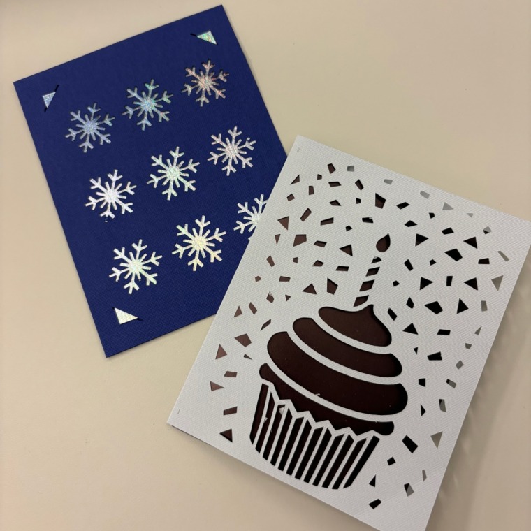 Greeting cards made with the Cricut Joy Xtra sit on a table.