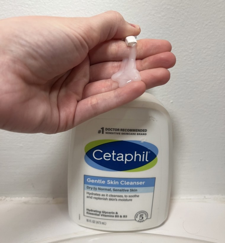 Woman pumping cleanser onto hand