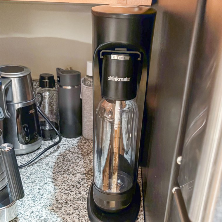 Drinkmate Omnifizz soda maker sitting on a countertop.
