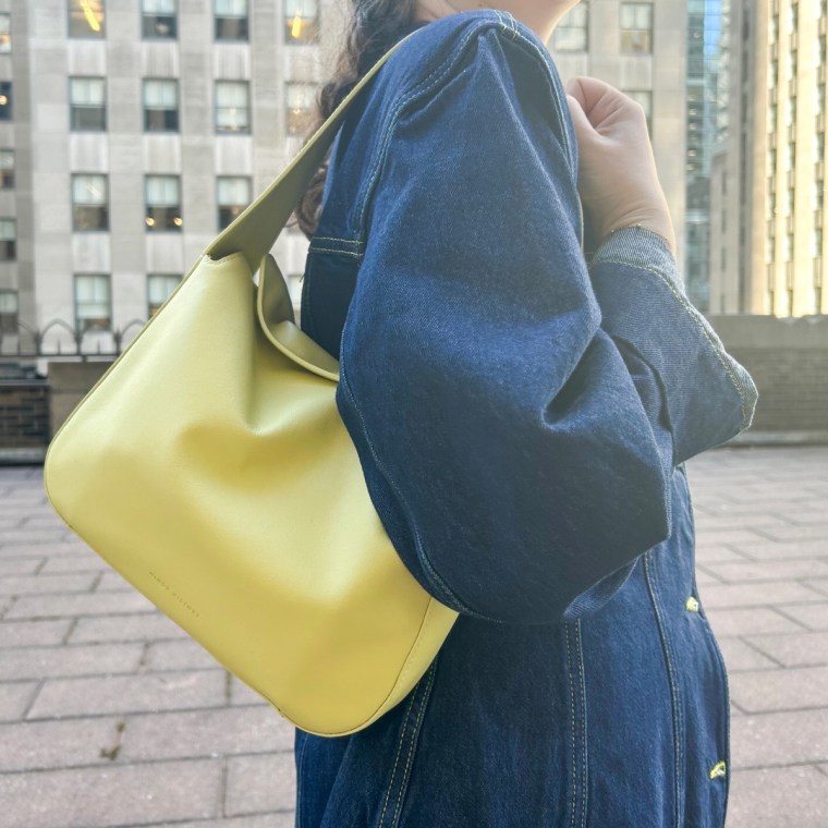 Woman wearing Minor History The Frame Shoulder Bag