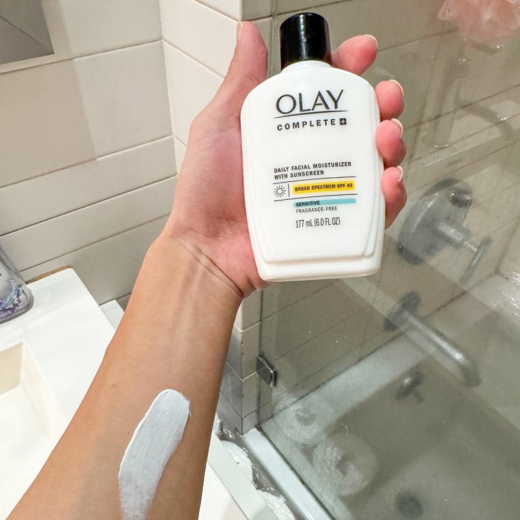 Olay Complete+ Moisturizer with Sunscreen swatched on back of arm.