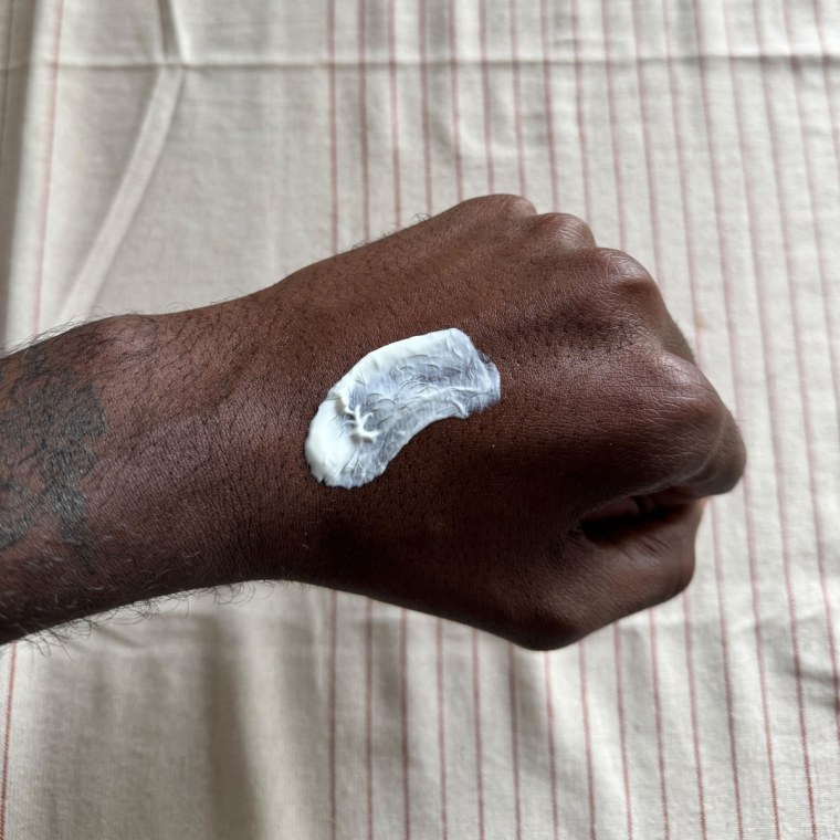 Man swatches a La Roche Posay Toleriane Double Repair Moisturizer with SPF on his hand.