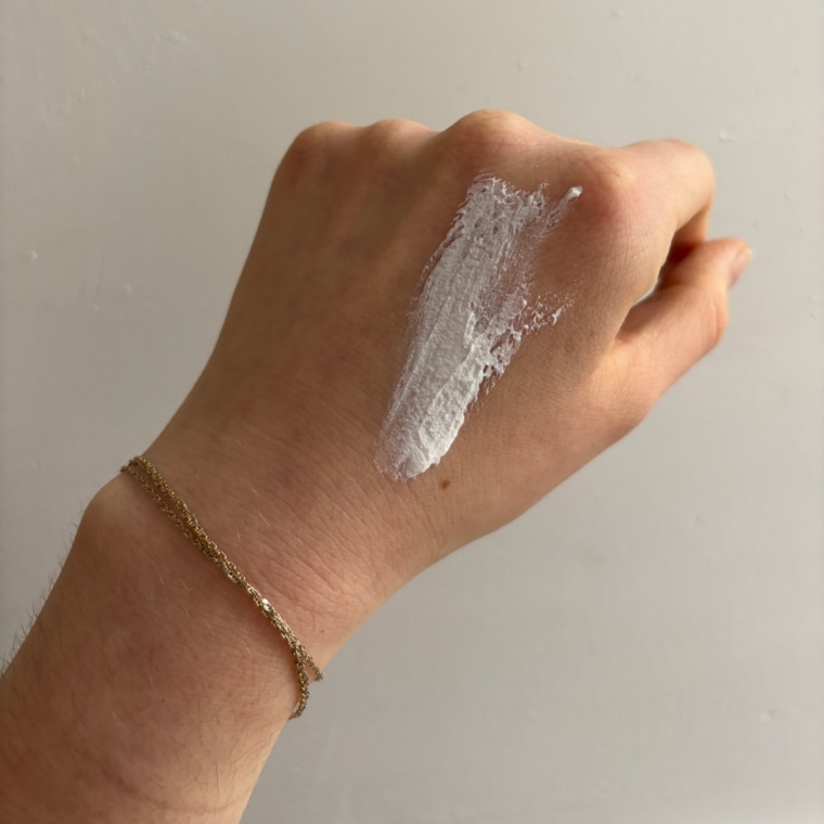 Sunscreen on the back of woman’s hand