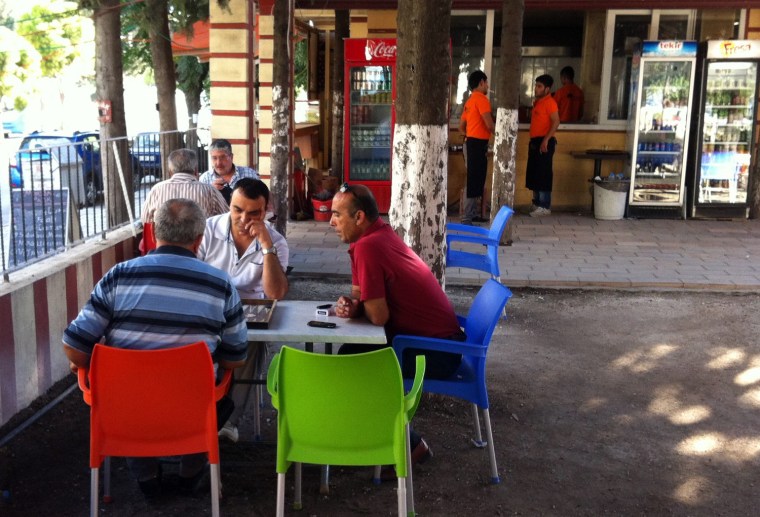 At the popular outdoor Sumerler Cafe in Antakya, Turkey, locals relax and play backgammon.