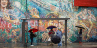 Angelenos in the  Latino neighborhood of Boyle Heights wait for a bus in 2018.