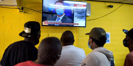Image: People inside the Twees Foods Store in the Third Ward where George Floyd grew up watch the verdict in Derek Chauvin's trial in Houston, Texas on April 20, 2021.