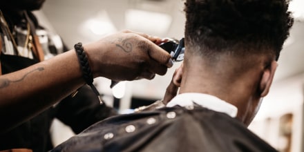 Image: Barber Giving A Haircut in His Shop