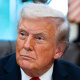 President Donald Trump sits in the Oval Office.